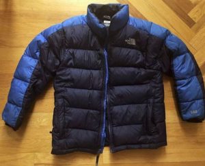 The North Face Nuptse ultralight down jacket on a floor