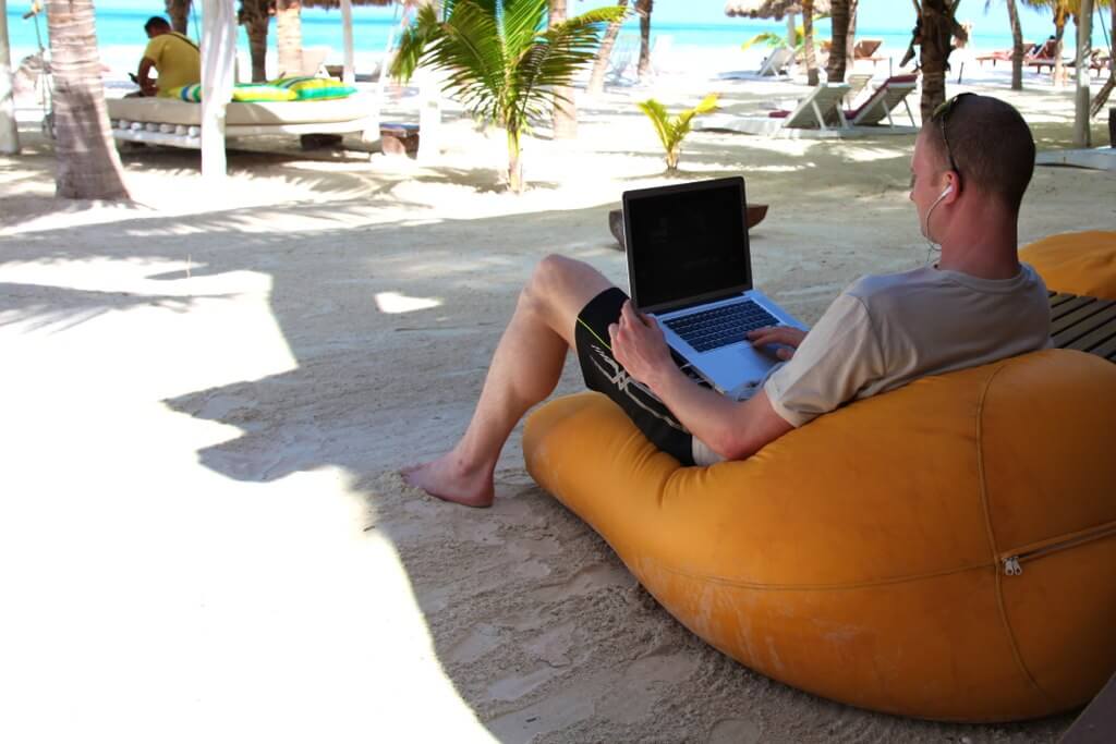 A Digital Nomad working at beach