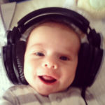 Baby laughing while listening on headphones