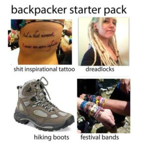 Tattoo, dreadlocks, hiking boots and festival bands