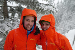 2 men wearing gore-tex jacket in snowy area