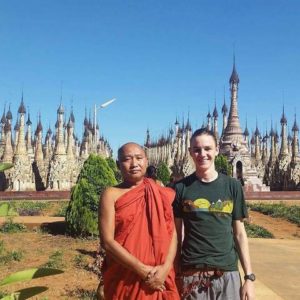 A Monk and and Man standing beside each other