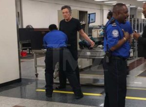 Man getting pat down screening at an airport