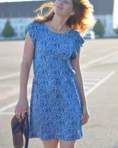 woman wearing modal skirt and purse in hand