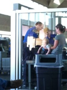 Baby getting screened at airport security