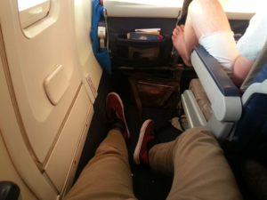 Leg rest space for a tall man in a plane