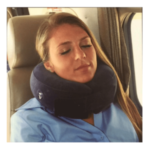 Woman with neck pillow on a flight