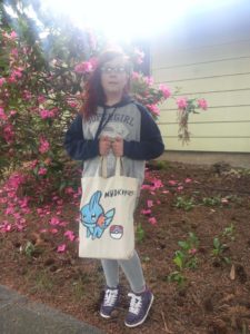 girl carrying travel tote bag