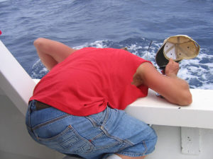 sea sick man vomiting