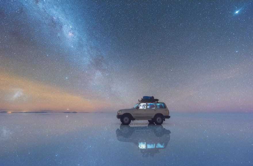 a SUV in front of milky way galaxy on Salar De Uyuni (Salt Flats), bolivia