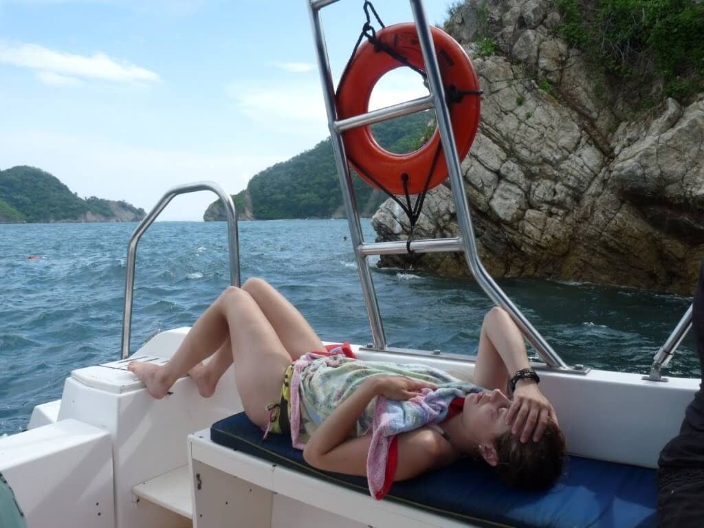 sea sick woman resting on boat