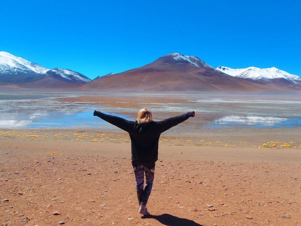 woman in front of bolivian lake